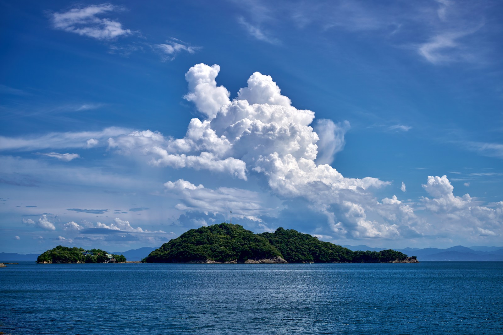 A small island in the middle of a body of water
